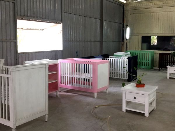 Sample room with painted cribs and nursery furniture